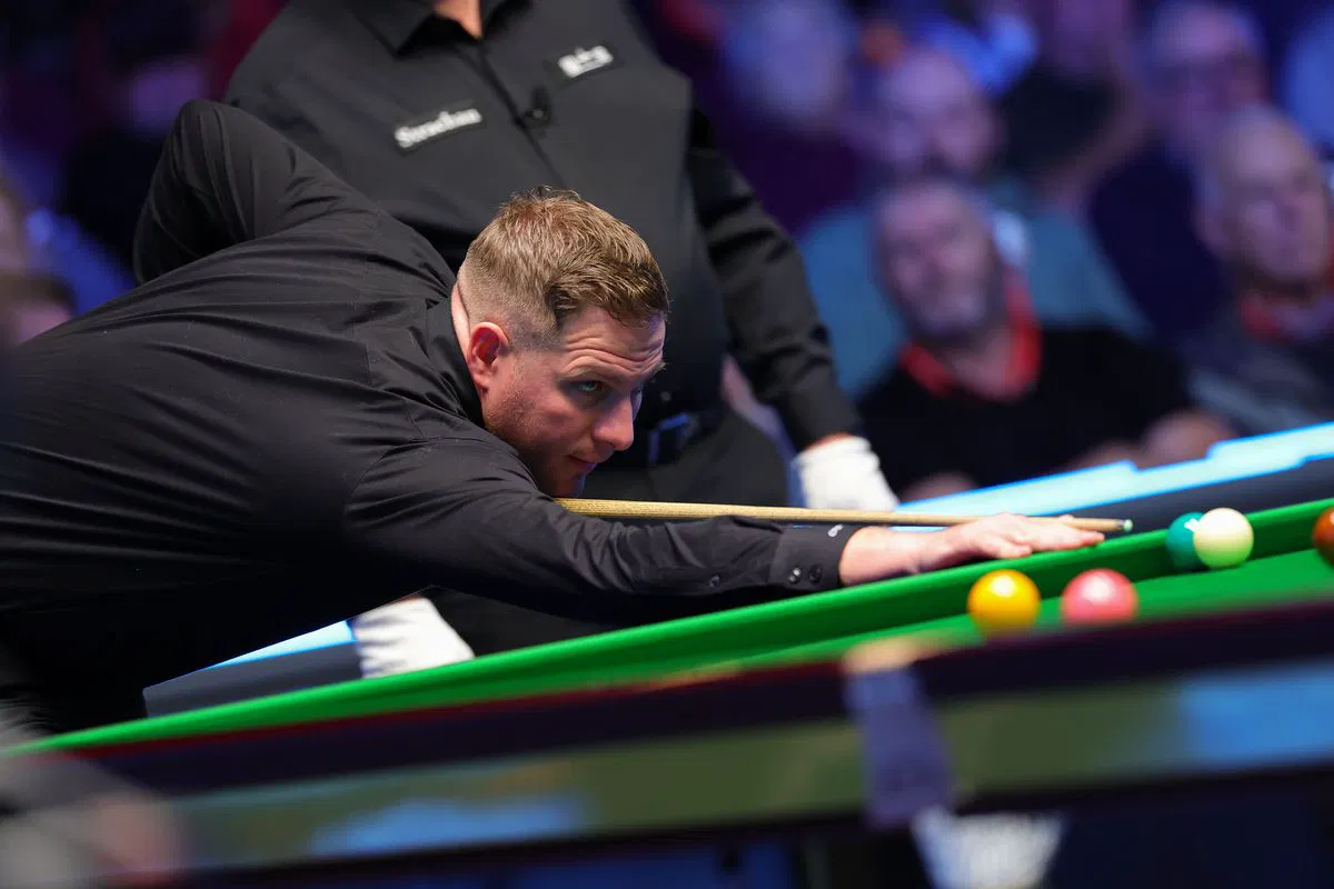 A player prepares for his next shot in Belfast