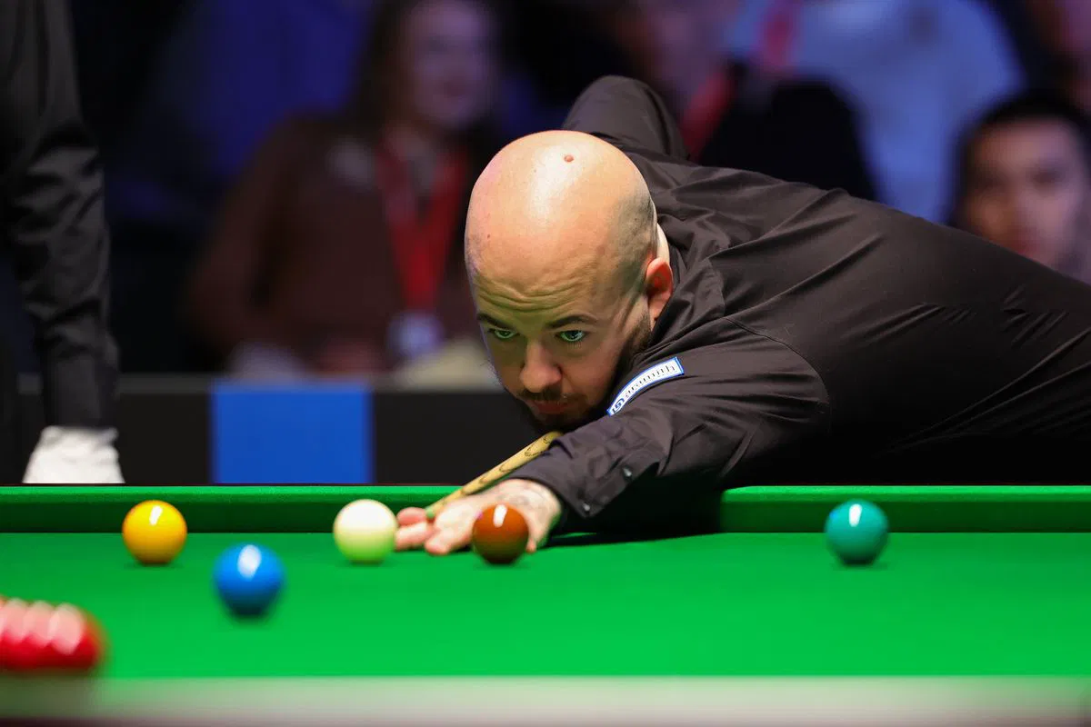 Northern Ireland Open player competing under arena lights